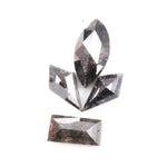 Set of natural salt and pepper diamonds with dark galaxy inclusions in mixed faceted shapes including marquise, kite and baguette cut stones for unique custom jewelry or engagement ring designs.