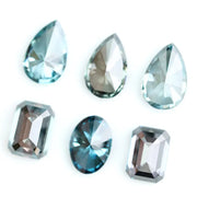 Fancy blue lab grown diamonds mix shapes including pear, oval and emerald cut loose CVD diamonds for engagement rings, custom jewelry making and fine jewelry designs with brilliant sparkle and modern sustainable luxury.