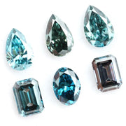 Fancy blue lab grown diamonds mix shapes including pear, oval and emerald cut loose CVD diamonds for engagement rings, custom jewelry making and fine jewelry designs with brilliant sparkle and modern sustainable luxury.