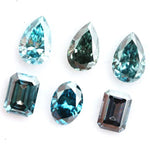 Fancy blue lab grown diamonds mix shapes including pear, oval and emerald cut loose CVD diamonds for engagement rings, custom jewelry making and fine jewelry designs with brilliant sparkle and modern sustainable luxury.