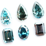 Fancy blue lab grown diamonds mix shapes including pear, oval and emerald cut loose CVD diamonds for engagement rings, custom jewelry making and fine jewelry designs with brilliant sparkle and modern sustainable luxury.