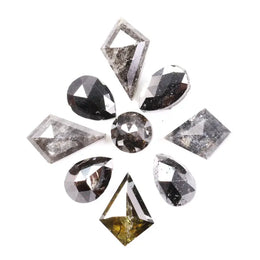 Natural salt and pepper diamonds in mixed geometric shapes including pear, kite, oval and round cuts with gray and black galaxy inclusions, loose natural diamonds for custom engagement rings and artisan jewelry design.