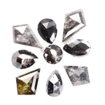 Natural salt and pepper diamonds in mixed geometric shapes including pear, kite, oval and round cuts with gray and black galaxy inclusions, loose natural diamonds for custom engagement rings and artisan jewelry design.