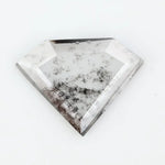 Shield cut lab grown diamond with clear body and natural-looking black inclusions in a salt and pepper pattern, faceted loose gemstone for custom jewelry