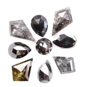 Natural salt and pepper diamonds in mixed geometric shapes including pear, kite, oval and round cuts with gray and black galaxy inclusions, loose natural diamonds for custom engagement rings and artisan jewelry design.