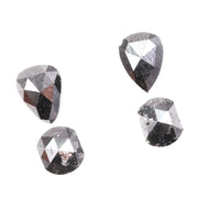 Natural salt and pepper rose cut diamond set featuring pear, kite, and cushion shapes with gray inclusions, rustic natural diamond gemstones for custom engagement rings and fine jewelry making.