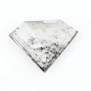 Shield cut lab grown diamond with clear body and natural-looking black inclusions in a salt and pepper pattern, faceted loose gemstone for custom jewelry