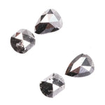Natural salt and pepper rose cut diamond set featuring pear, kite, and cushion shapes with gray inclusions, rustic natural diamond gemstones for custom engagement rings and fine jewelry making.