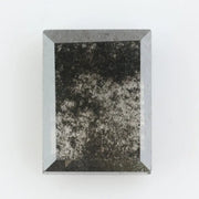 Baguette cut salt and pepper lab grown diamond with natural black inclusions, unique speckled pattern, transparent edges, ethically grown conflict free gemstone for modern jewelry