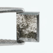 Baguette cut salt and pepper lab grown diamond with natural black inclusions, unique speckled pattern, transparent edges, ethically grown conflict free gemstone for modern jewelry