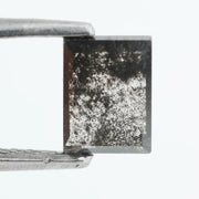Baguette cut salt and pepper lab grown diamond with natural black inclusions, unique speckled pattern, transparent edges, ethically grown conflict free gemstone for modern jewelry