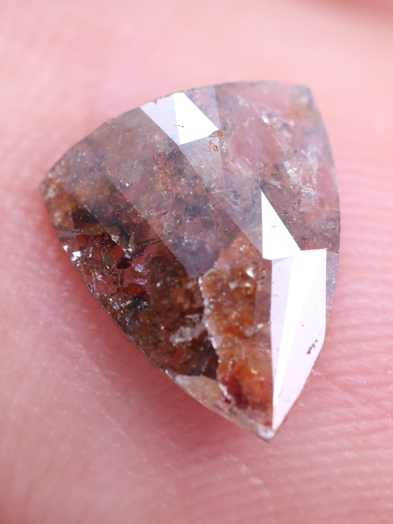 Trillion-shaped diamond on a finger