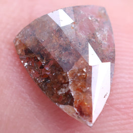 Trillion-shaped diamond on a finger