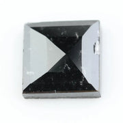 Close-up of a princess cut lab-grown diamond with square shape, sharp facets, and visible inclusions, showcasing modern geometric brilliance and ethical gemstone craftsmanship for jewelry making