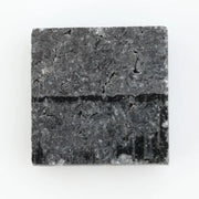 Close-up of a princess cut lab-grown diamond with square shape, sharp facets, and visible inclusions, showcasing modern geometric brilliance and ethical gemstone craftsmanship for jewelry making