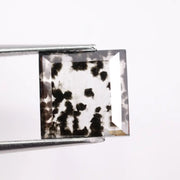 2.59 Ct black and white square cut lab grown diamond loose stone with contrasting tones and geometric shape.