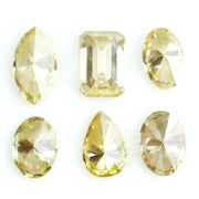Fancy yellow lab grown loose diamonds in marquise pear oval and emerald cut shapes for luxury jewelry making