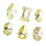 Fancy yellow lab grown loose diamonds in marquise pear oval and emerald cut shapes for luxury jewelry making