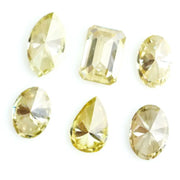 Fancy yellow lab grown loose diamonds in marquise pear oval and emerald cut shapes for luxury jewelry making
