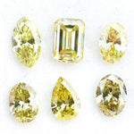 Fancy yellow lab grown loose diamonds in marquise pear oval and emerald cut shapes for luxury jewelry making