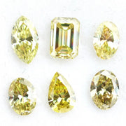 Fancy yellow lab grown loose diamonds in marquise pear oval and emerald cut shapes for luxury jewelry making