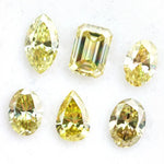 Fancy yellow lab grown loose diamonds in marquise pear oval and emerald cut shapes for luxury jewelry making