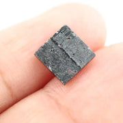 Close-up of a princess cut lab-grown diamond with square shape, sharp facets, and visible inclusions, showcasing modern geometric brilliance and ethical gemstone craftsmanship for jewelry making