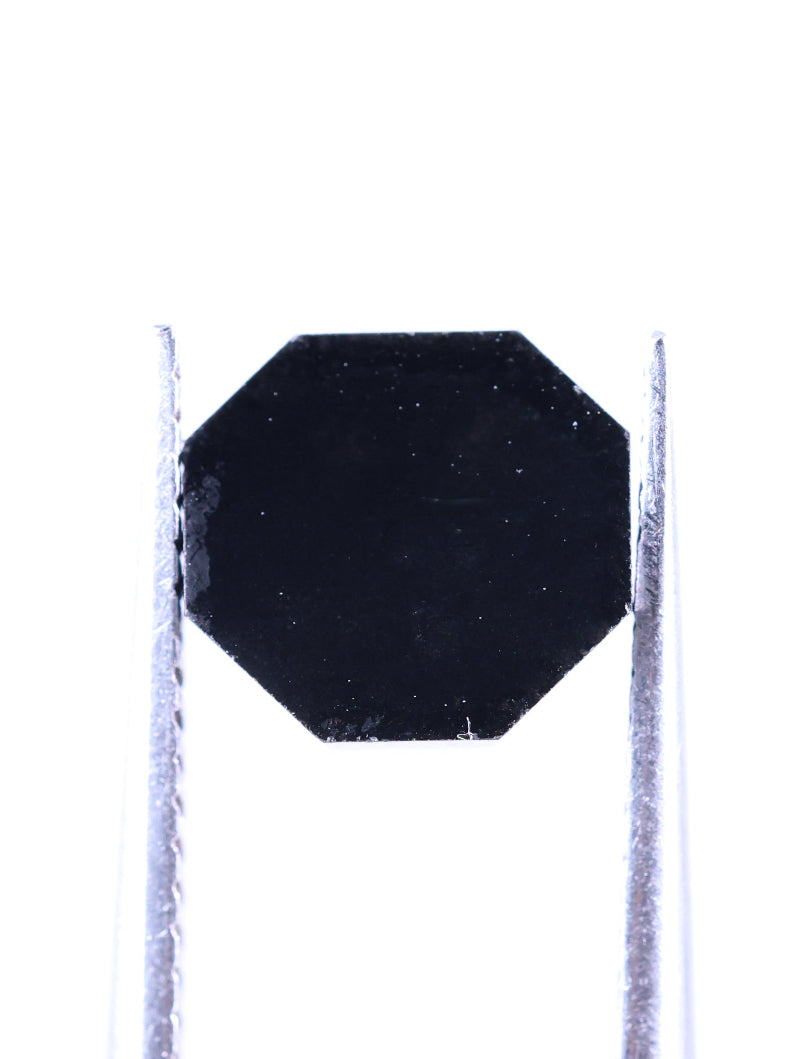 Black octagonal object on a white background
