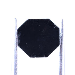 Black octagonal object on a white background