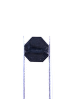 Black octagonal object on a white background