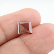 Square pyramid cut lab grown diamond with soft champagne tone, high clarity, polished facets, and modern geometric shape on a clean white background