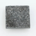 Square step-cut lab grown diamond with crisp geometric facets, high clarity, and modern symmetrical design on a clean white background