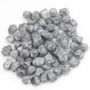 dark grey natural diamond with a rugged rough surface for wholesale diamond buyers