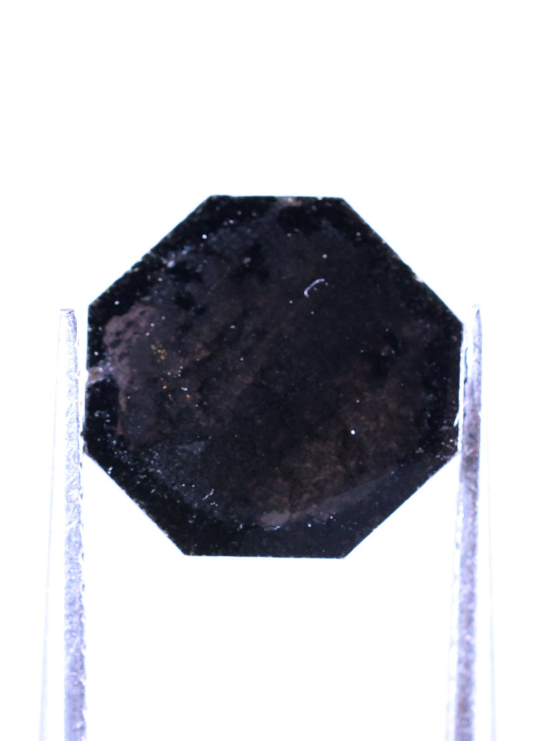 Black octagonal diamond on a white background