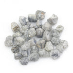 grey white natural diamond with a rugged unpolished surface for jewelry making