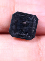 Black diamond on a person's palm