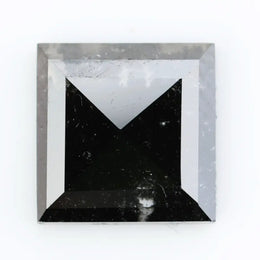Lab grown diamond with square geometric cut featuring high contrast black and white faceting, sharp edges, and modern architectural design