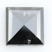 Lab grown diamond with square geometric cut featuring high contrast black and white faceting, sharp edges, and modern architectural design