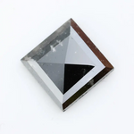 Lab grown diamond with square geometric cut featuring high contrast black and white faceting, sharp edges, and modern architectural design