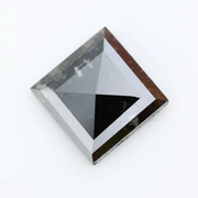 Lab grown diamond with square geometric cut featuring high contrast black and white faceting, sharp edges, and modern architectural design