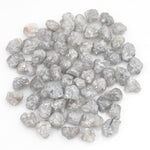 light grey natural diamond with a rough unpolished surface for custom jewelry creation