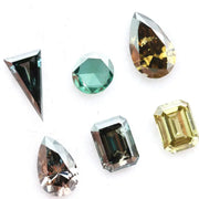 Fancy color lab grown diamond mixed shape CVD loose diamonds including emerald, pear, round and triangle cut for fine jewelry making.