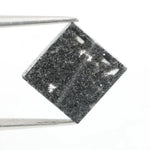 Lab grown diamond with square geometric cut featuring high contrast black and white faceting, sharp edges, and modern architectural design