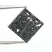Lab grown diamond with square geometric cut featuring high contrast black and white faceting, sharp edges, and modern architectural design