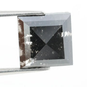 Lab grown diamond with square geometric cut featuring high contrast black and white faceting, sharp edges, and modern architectural design