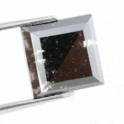 Lab grown diamond with square geometric cut featuring high contrast black and white faceting, sharp edges, and modern architectural design