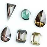 Fancy color lab grown diamond mixed shape CVD loose diamonds including emerald, pear, round and triangle cut for fine jewelry making.