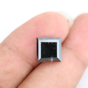 Lab grown diamond with square geometric cut featuring high contrast black and white faceting, sharp edges, and modern architectural design