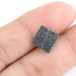 Lab grown diamond with square geometric cut featuring high contrast black and white faceting, sharp edges, and modern architectural design