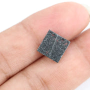 Lab grown diamond with square geometric cut featuring high contrast black and white faceting, sharp edges, and modern architectural design